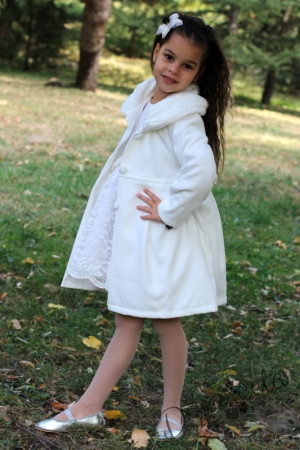 Children's coat for a girl in champagne colour with lace and ribbons