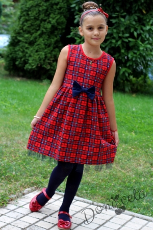 Children's dress in red and blue with a vest in dark blue