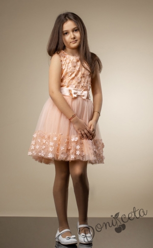 Официална детска рокля на цветя в прасковено с пола от тюл, без ръкав и коланче с панделка 79653211