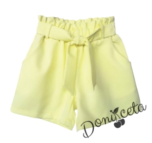 Children's set of shorts in yellow with belt and tunic in white with girl